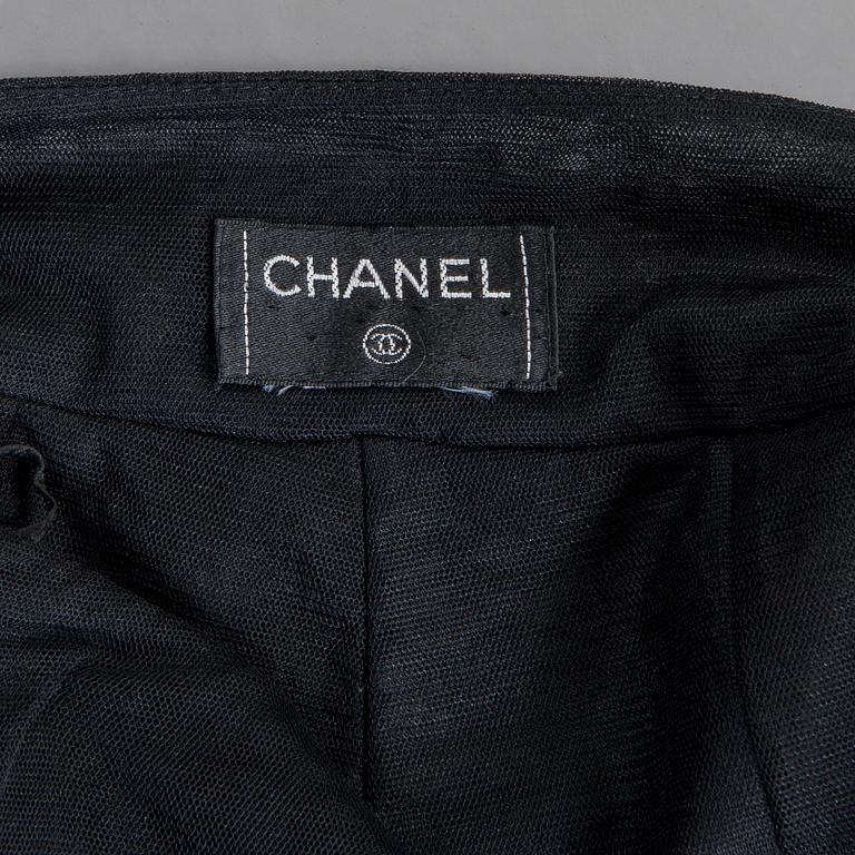 CHANEL, a black mesh evening pant.