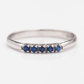 A 14K white gold ring with sapphires.