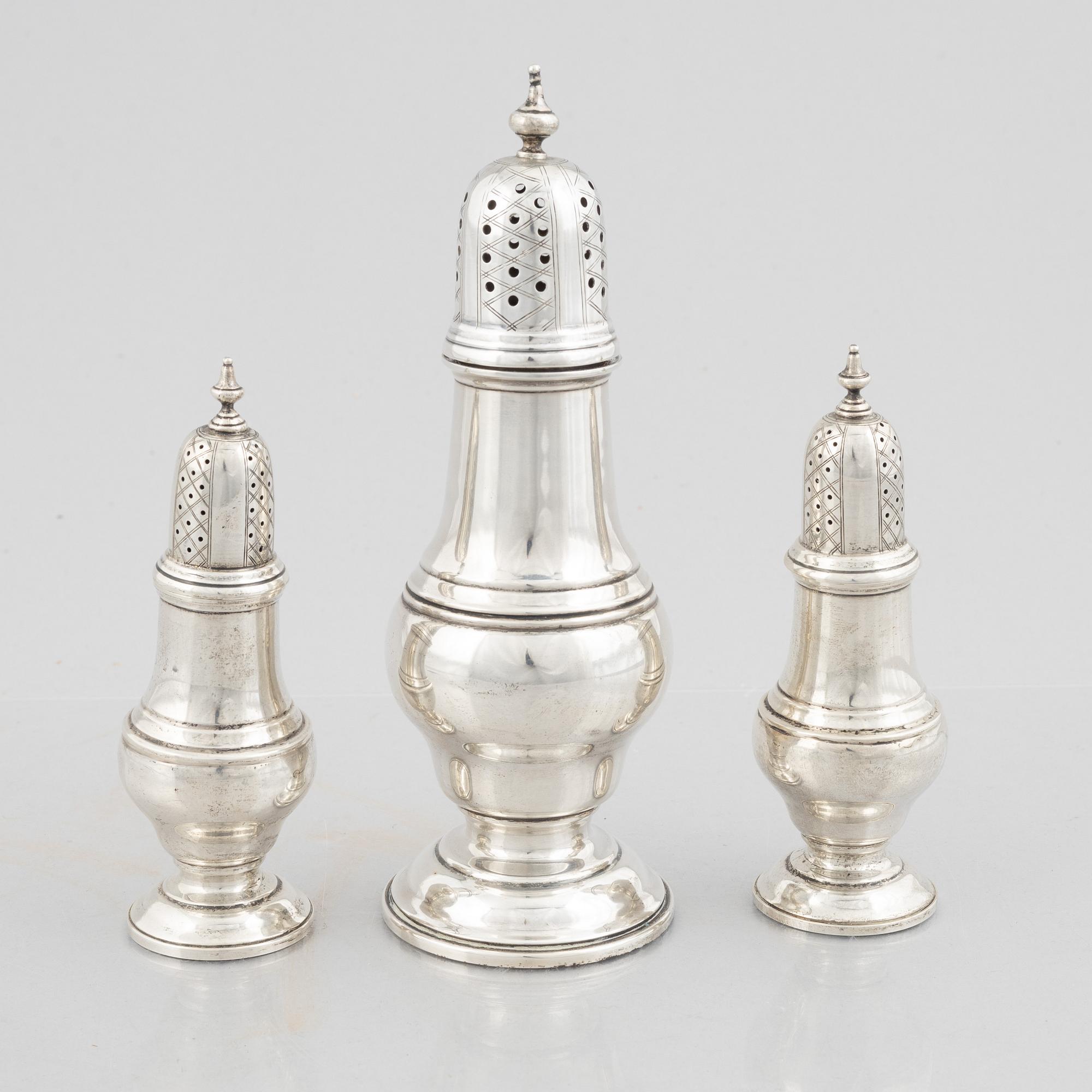 Three sterling silver shakers, 20th Century.