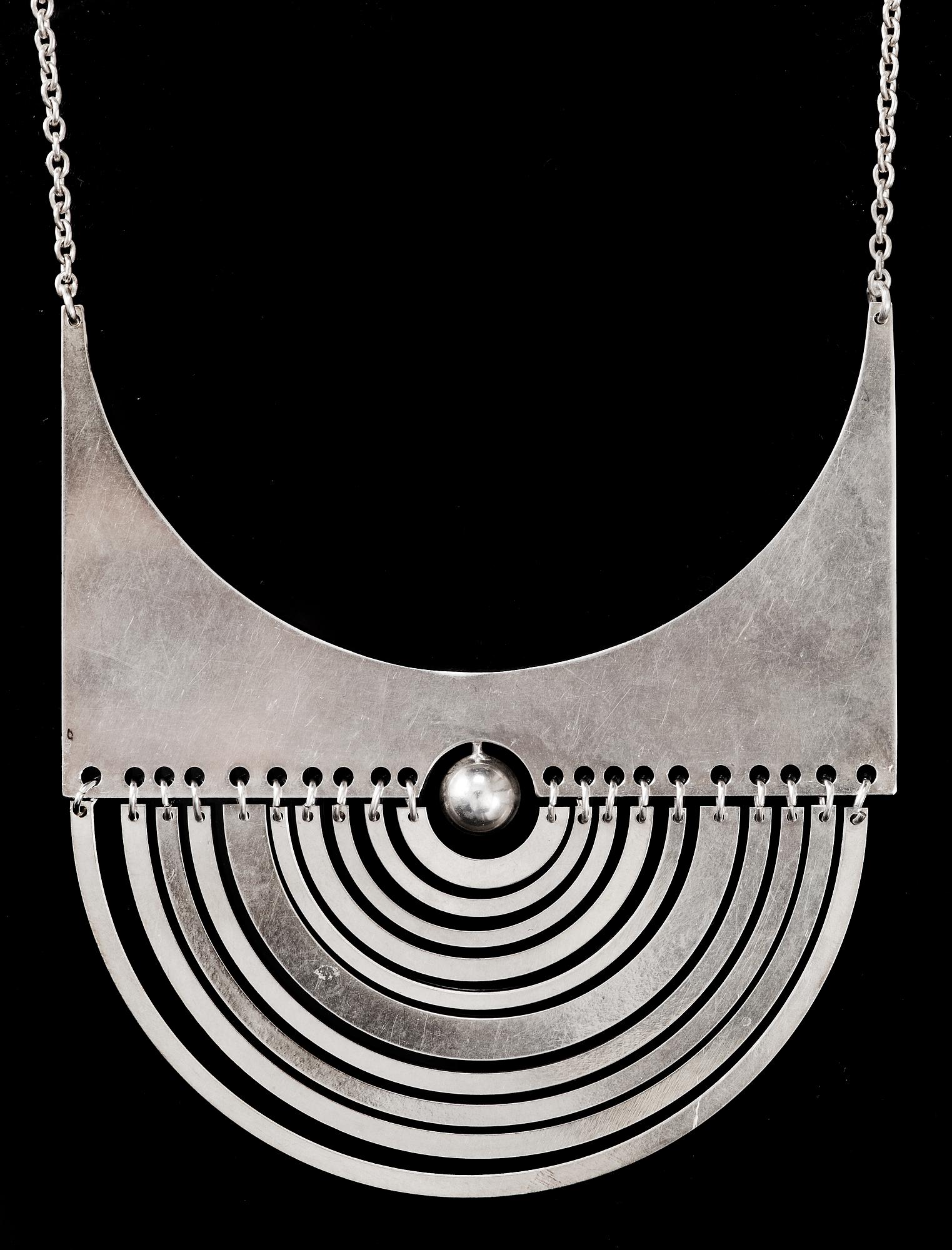 Tapio Wirkkala, A Tapio Wirkkala sterling pendant 'Half-Moon' and chain by Nils Westerback, Helsinki 1972.