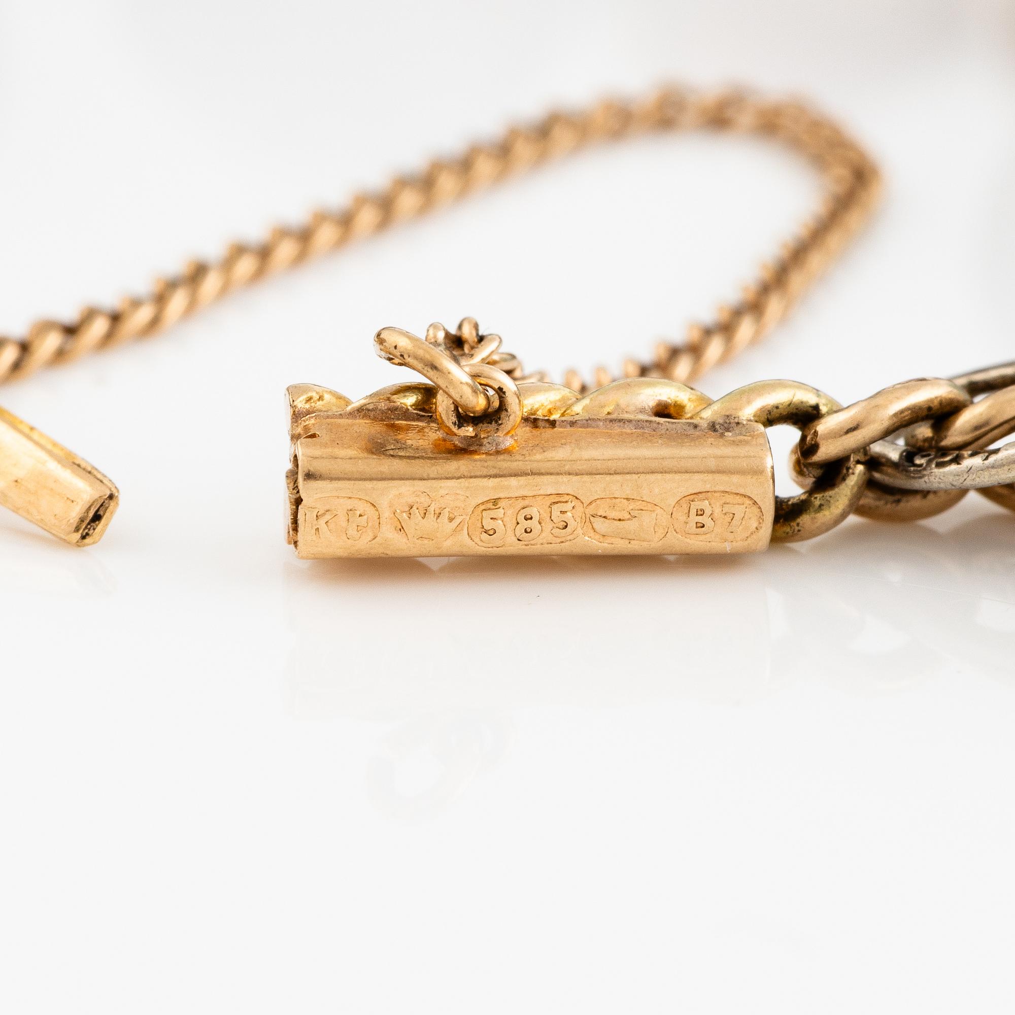 Bracelet with charms in the shape of eggs, the bracelet is 14K gold and 13 loose charms in the shape of eggs.