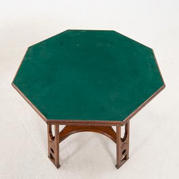 An early 1900s oak game table.