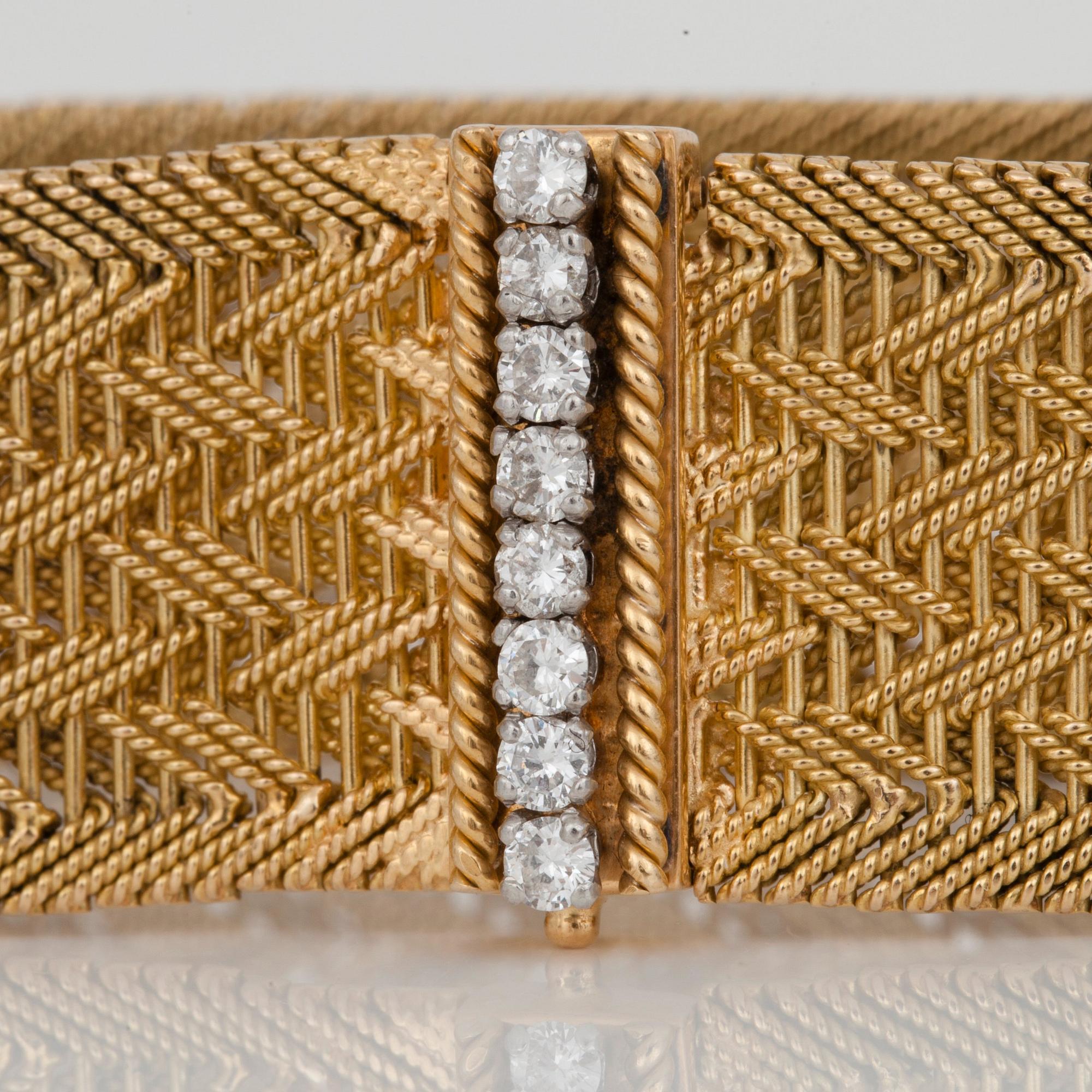 A diamond and gold bracelet. Total carat weight of diamonds circa 0.50ct.