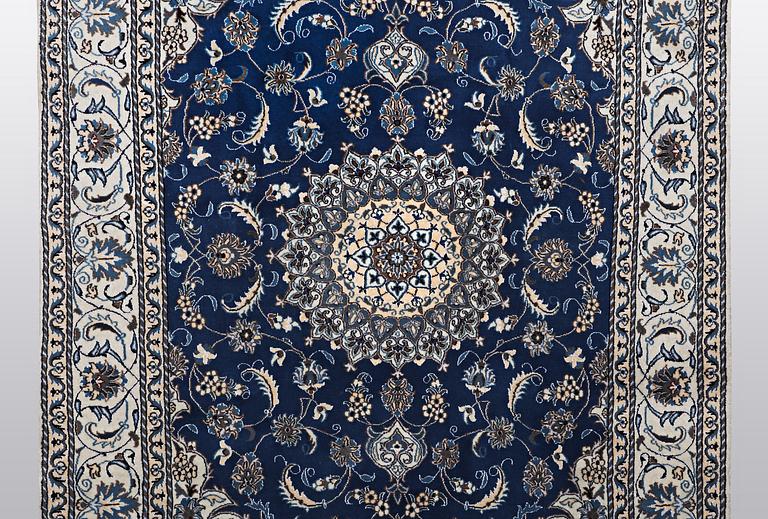 A carpet, Nain, part silk 9 LAA, ca 310 x 203 cm.