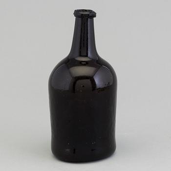 An 18th Century glass bottle.