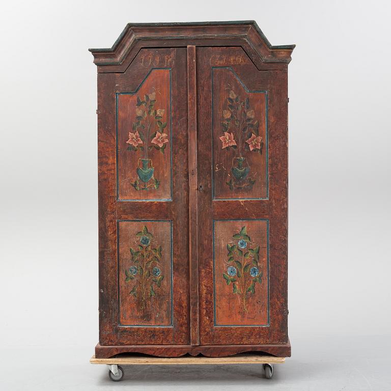 A Swedish painted cupboard dated 1863.
