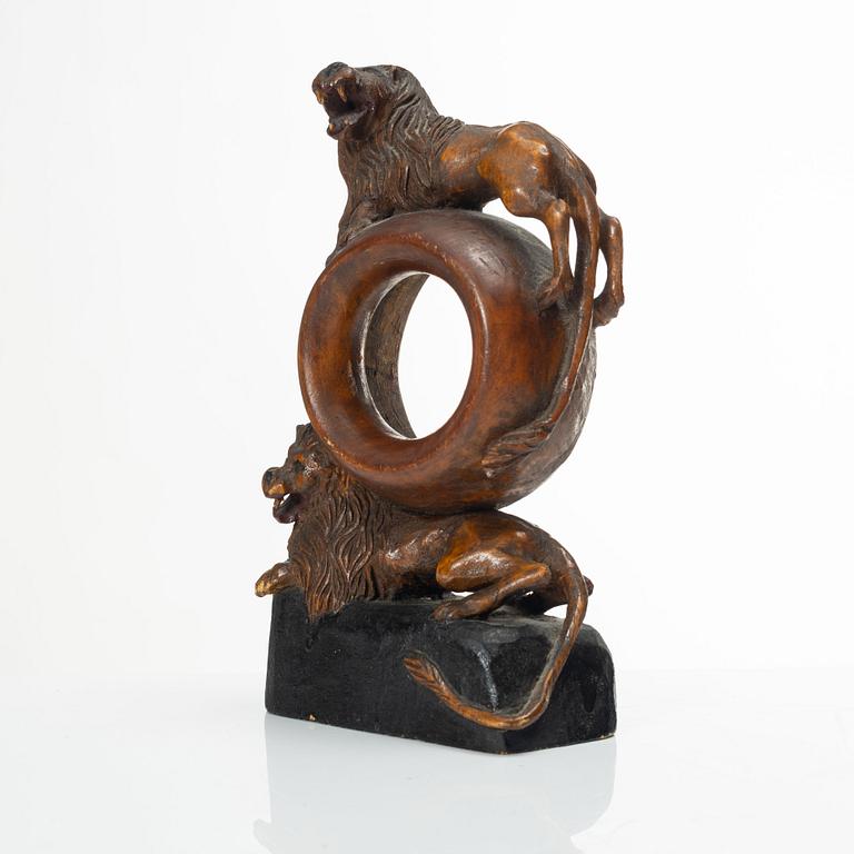 A carved pocket watch stand, Sweden, 19th century.