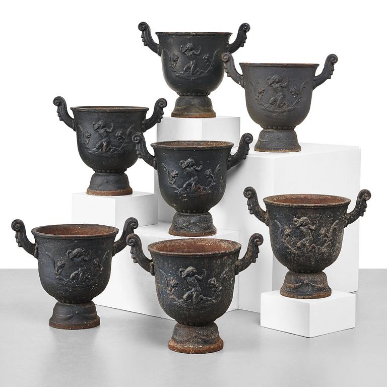 Ivar Johnsson, a set of seven Swedish Grace black painted cast iron jardenieres by Näfveqvarns Bruk, Sweden.