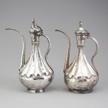 A pair of silver plated jugs, the 20th century.