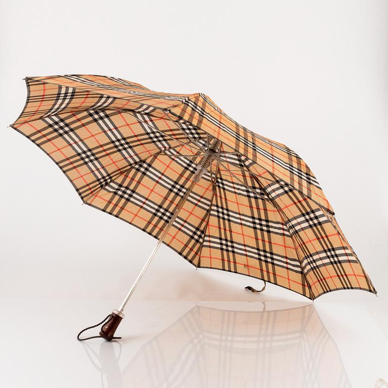 Burberry, a Nova Check tote bag and umbrella.