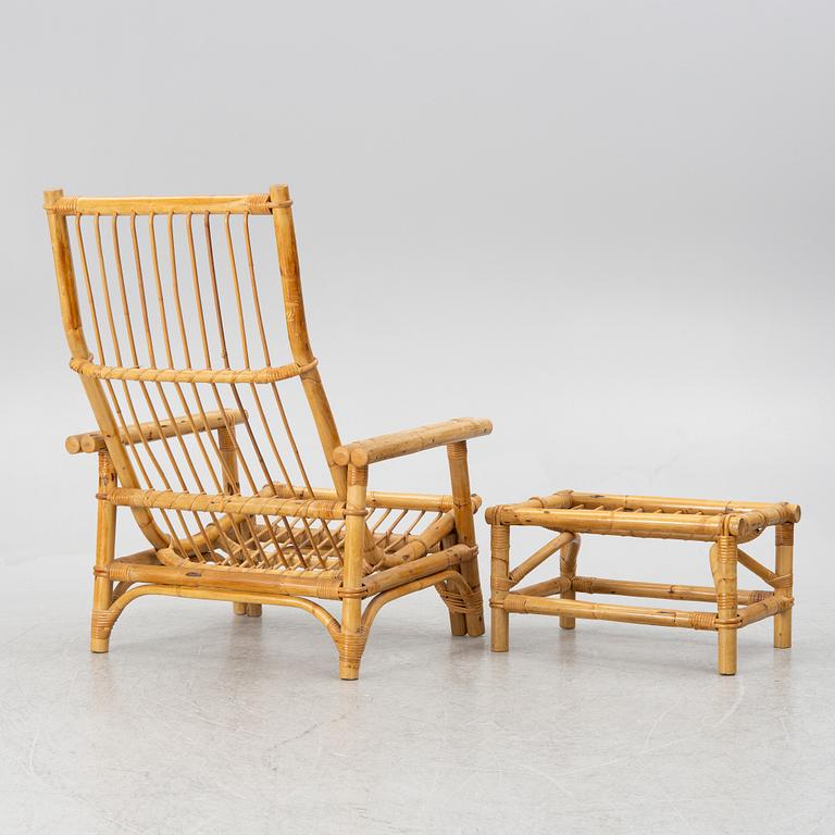 An easy chair with foot stool, end of the 20th century.