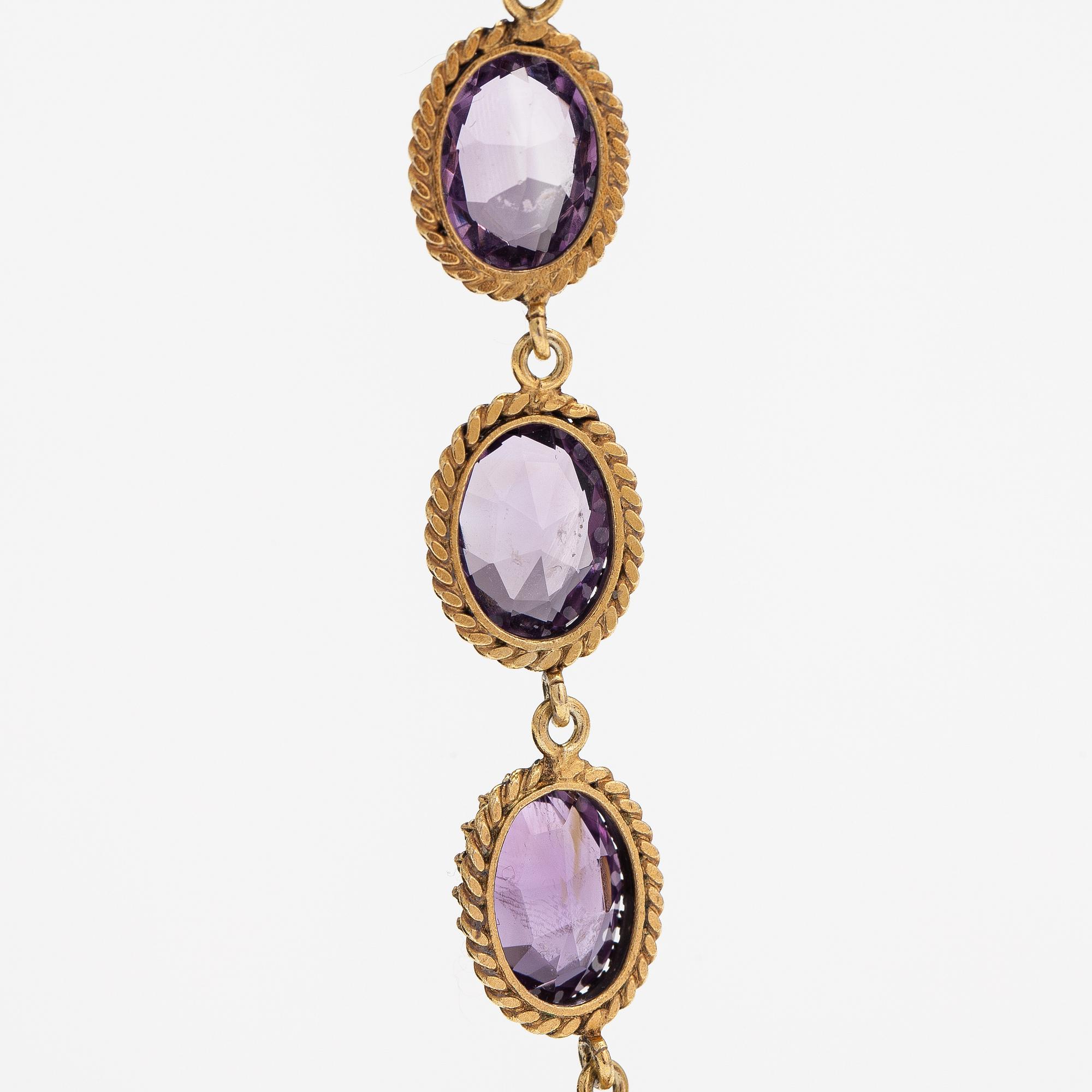 A necklace, bracelet and two brooches in gilded silver and with amethysts and pearls.