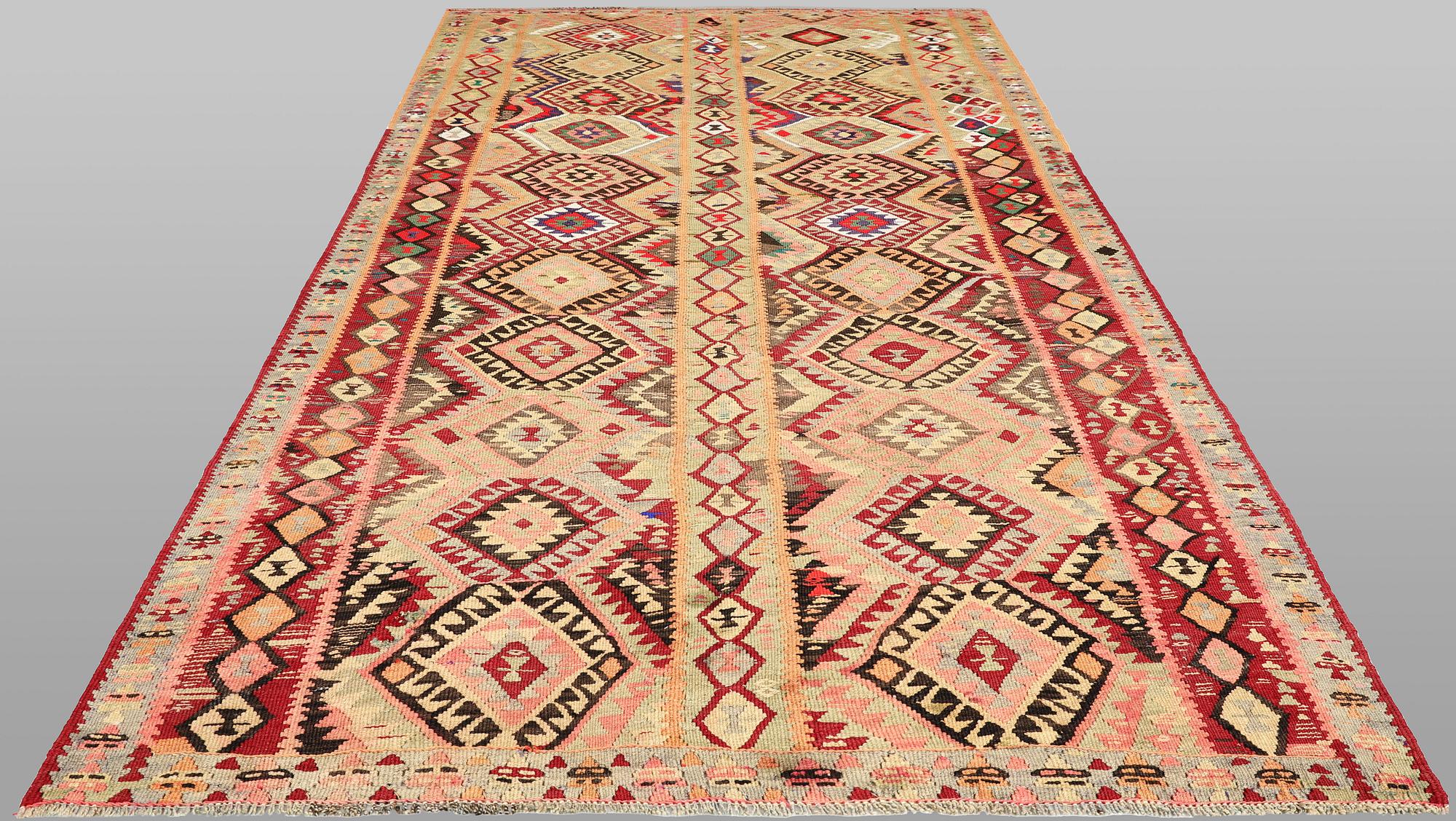 A Nomad Kelim Kord carpet, 387 x 185 cm.