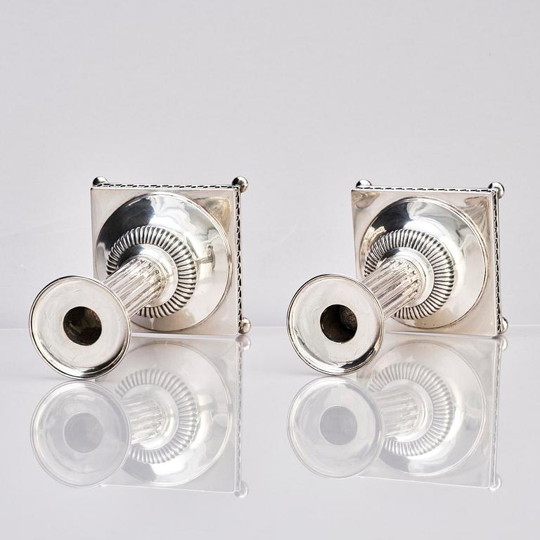 A pair of Swedish 18th century Gustavian silver candlesticks, marks of Arvid Floberg, Stockholm 1799.