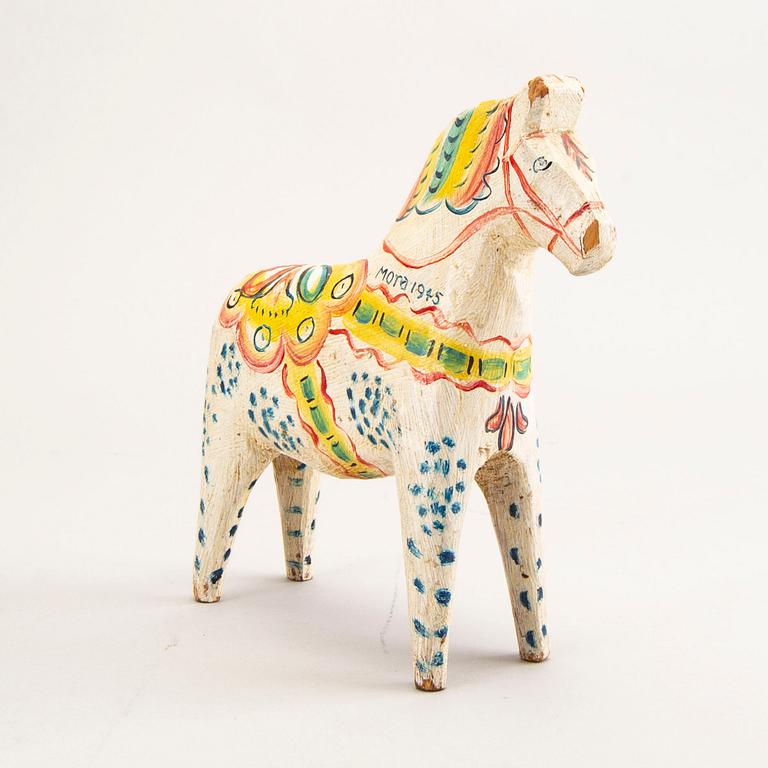 A Swedish painted and dated 1945 wooden horse.