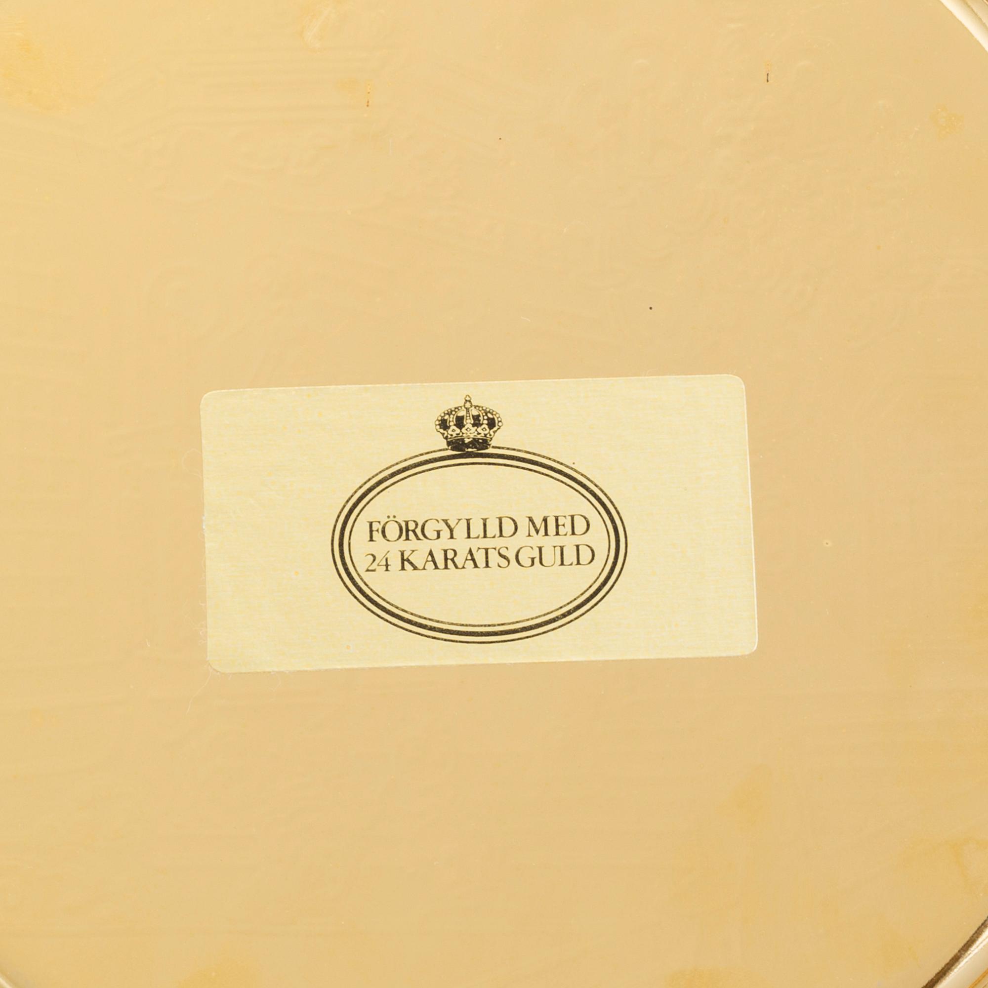 12 brass plates by Skultuna.