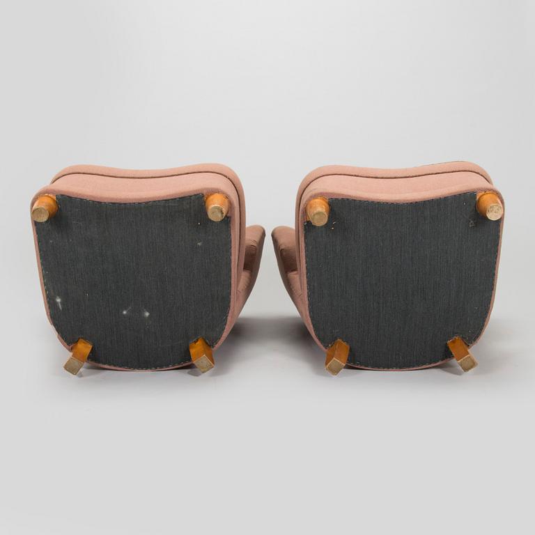 A pair of mid-20th century armchairs.