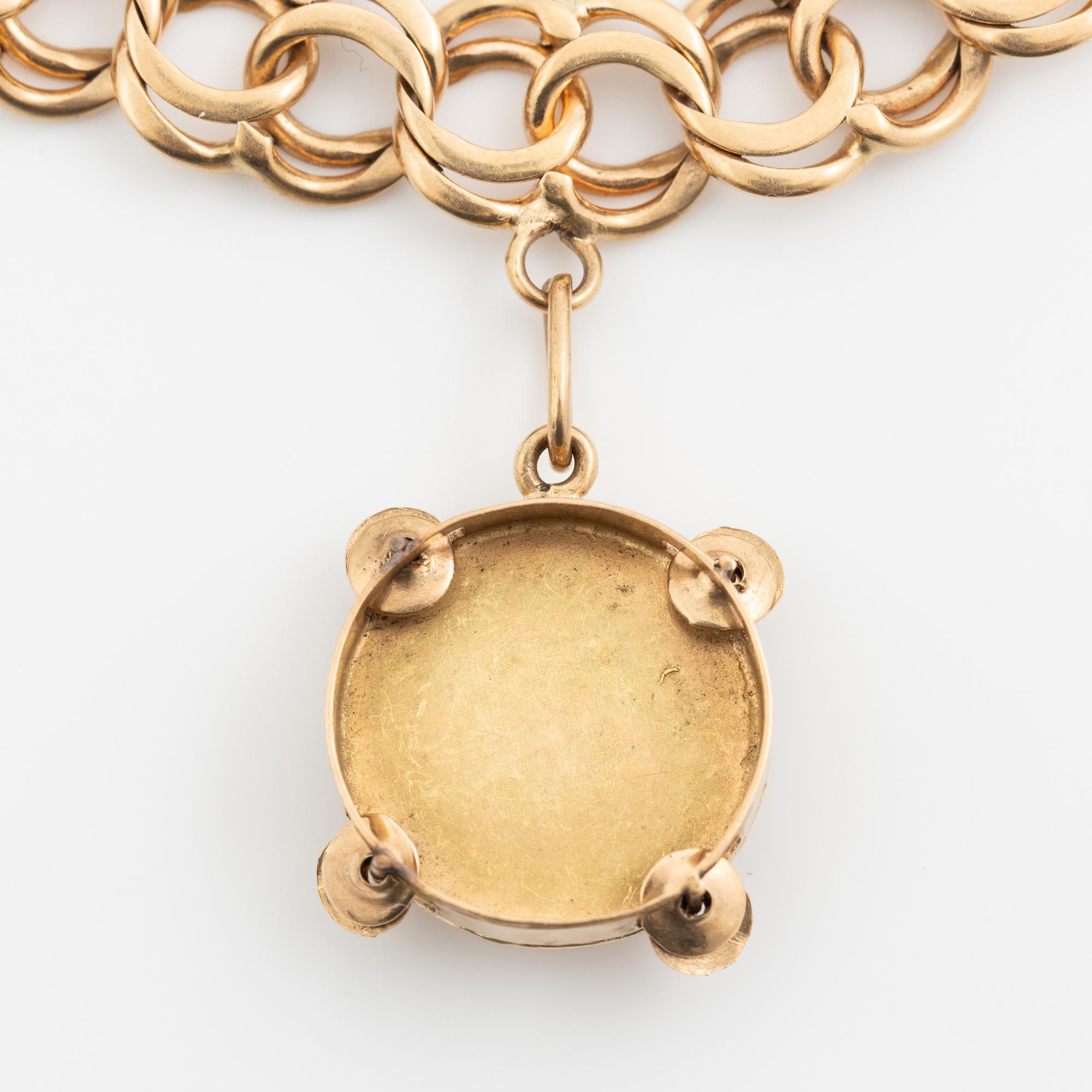 Armband 18K guld bismarcklänk, med berlocker.