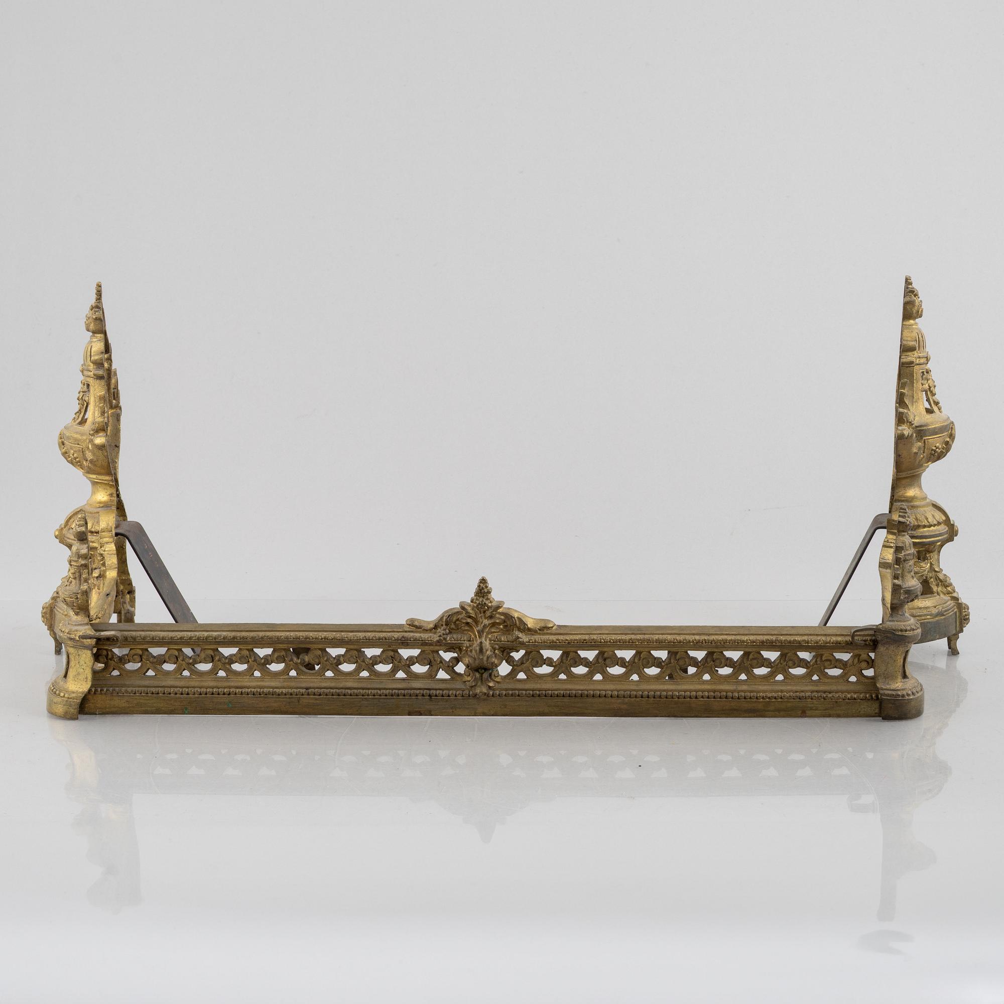 A pair of Louis XVI-style bronze andirons, France, later part of the 19th century.