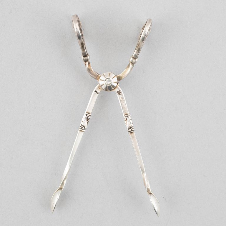 A sterling silver sugar tongs, mark of Georg Jensen, Denmark 1933-44.