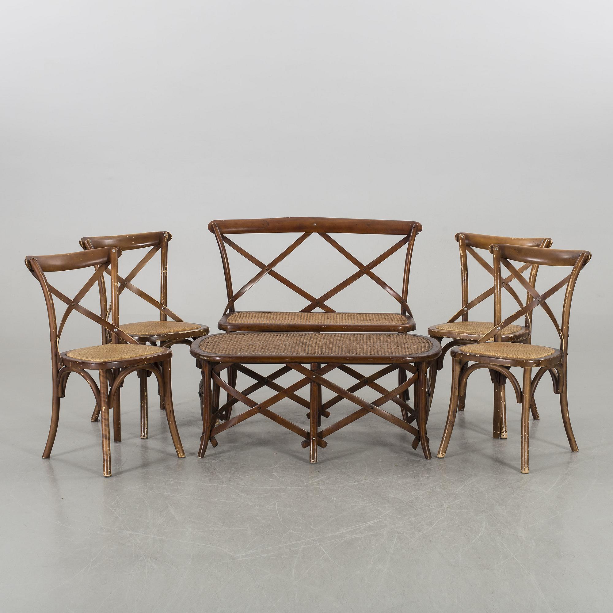 A wooden sofa, a table and four chairs, later part of the 20th century.