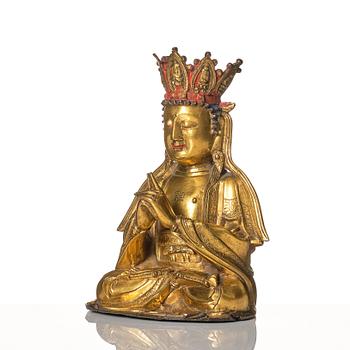 A gilt-bronze figure of Vairochana, Ming dynasty (1638-1644).