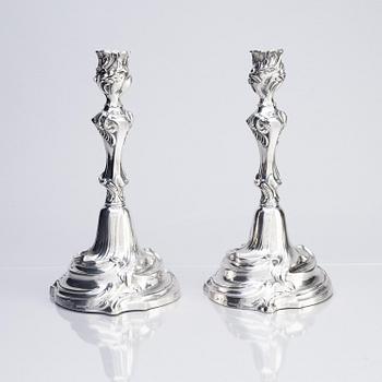 A pair of Swedish Rococo silver candlesticks, marks of Abraham Lundberg, Stockholm 1765.