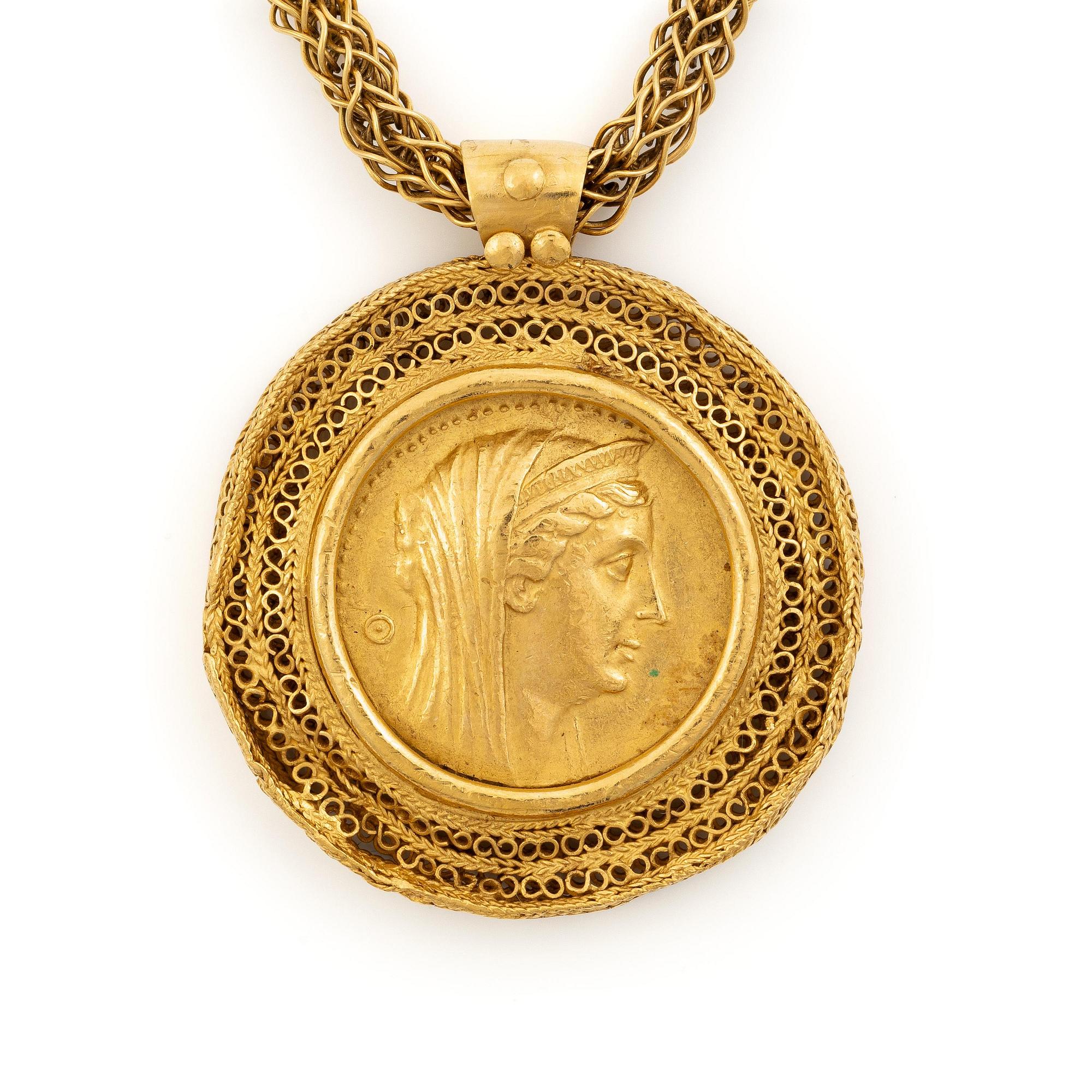 A necklace 18K gold set with a gold coin.