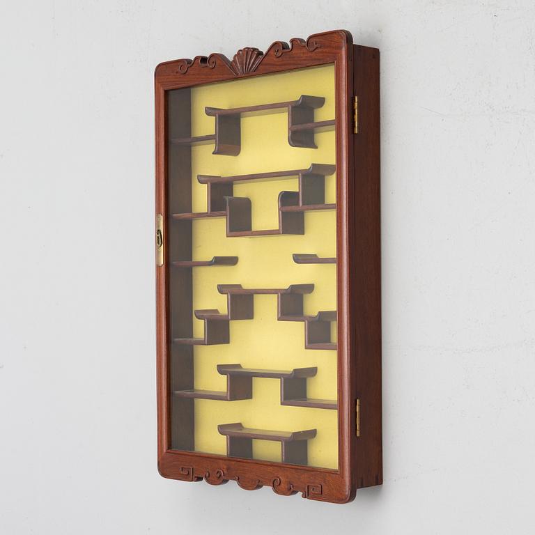 A wall-hanged display cabinet, China, second half of the 20th century.