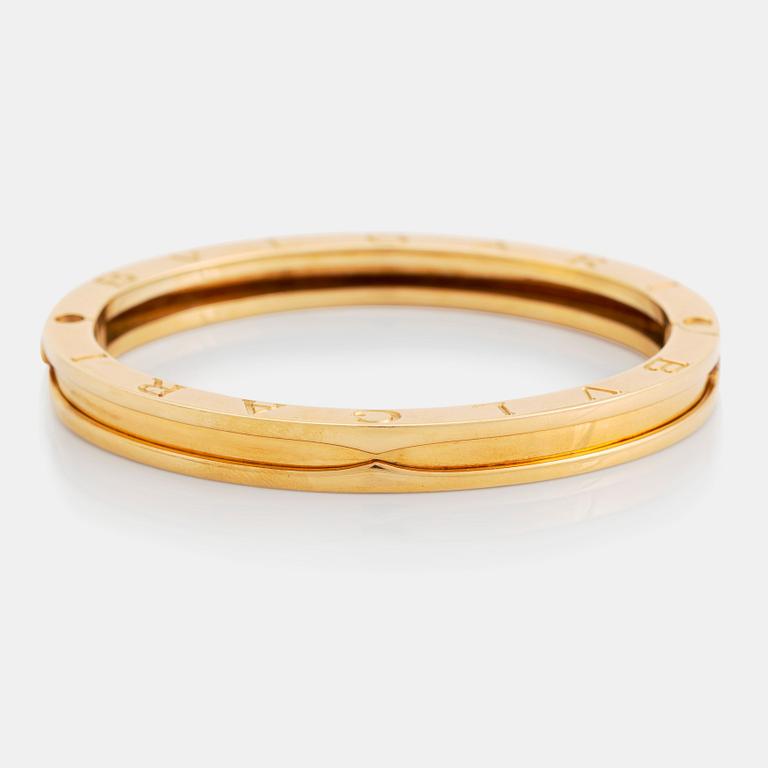 An 18K gold Bulgari bangle.