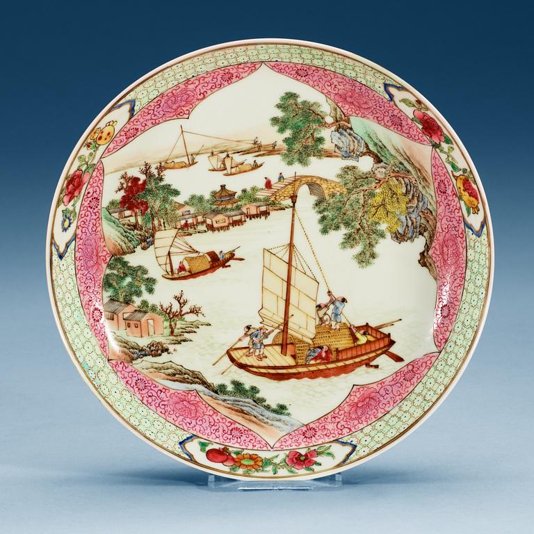 A 'famille-rose' saucer dish with a vivid river scenery, Qing dynasty.