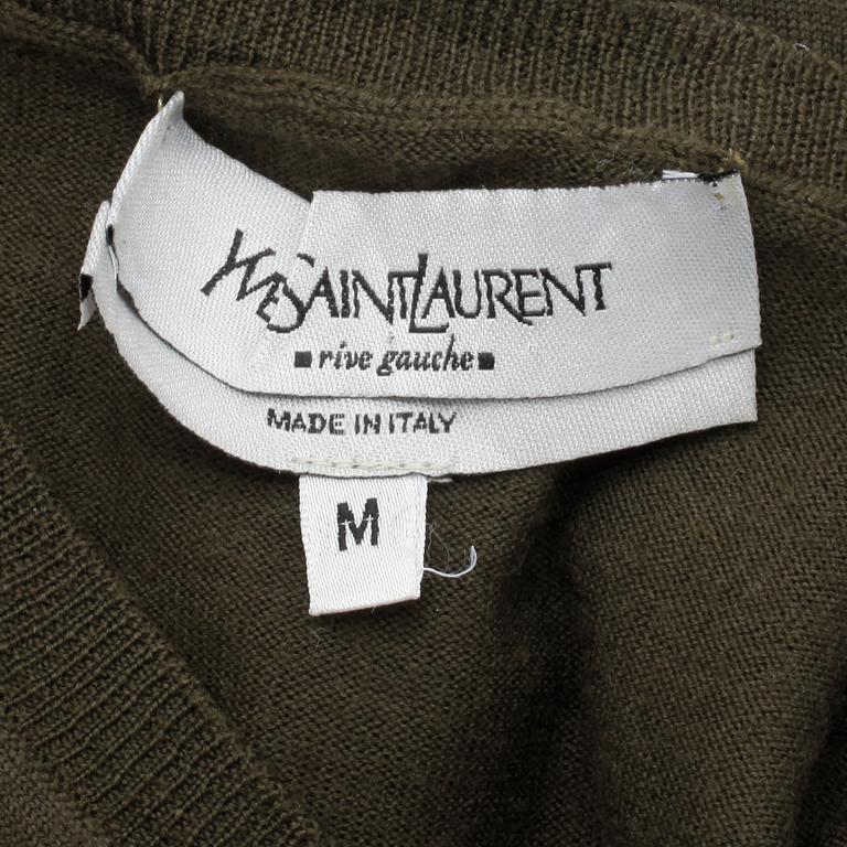 YVES SAINT LAURENT, a men's green wool sweater, size M.