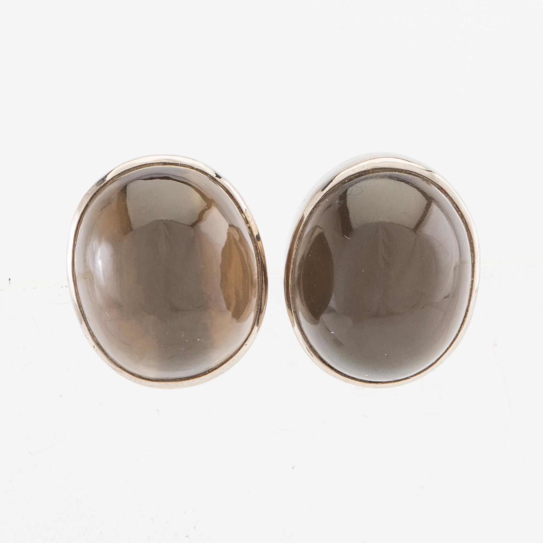 Earrings, a pair of 18K white gold with cabochon-cut grey moonstones, Gunnar Fahlström, Stockholm 1955.