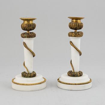 A pair of Louis XVI style candle sticks, circa 1900.