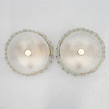 Carl Fagerlund, a pair of glass and brass ceiling lamps, Sweden, second half of the 20th century.