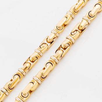 An 18K gold necklace/bracelet combination.