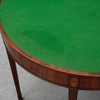 A pair of George III demi-lune mahogany card tables, first half of the 19th Century.