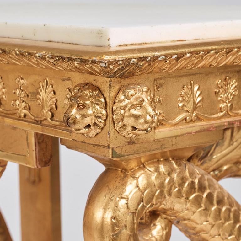 A pair of Swedish Empire carved and giltwood console tables, first half of the 19th century.