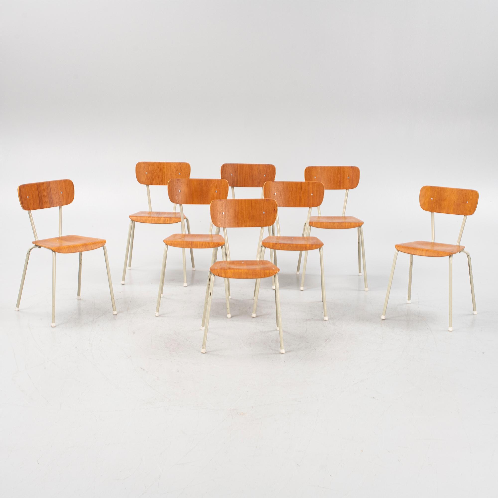 Eight teak veneered chairs, second part of the 20th Century.
