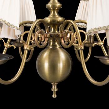 A 20th century baroque style brass ceiling light.