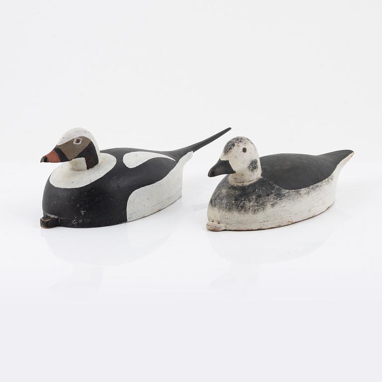 Two wooden decoy ducks, signed Eric Österman 1916.