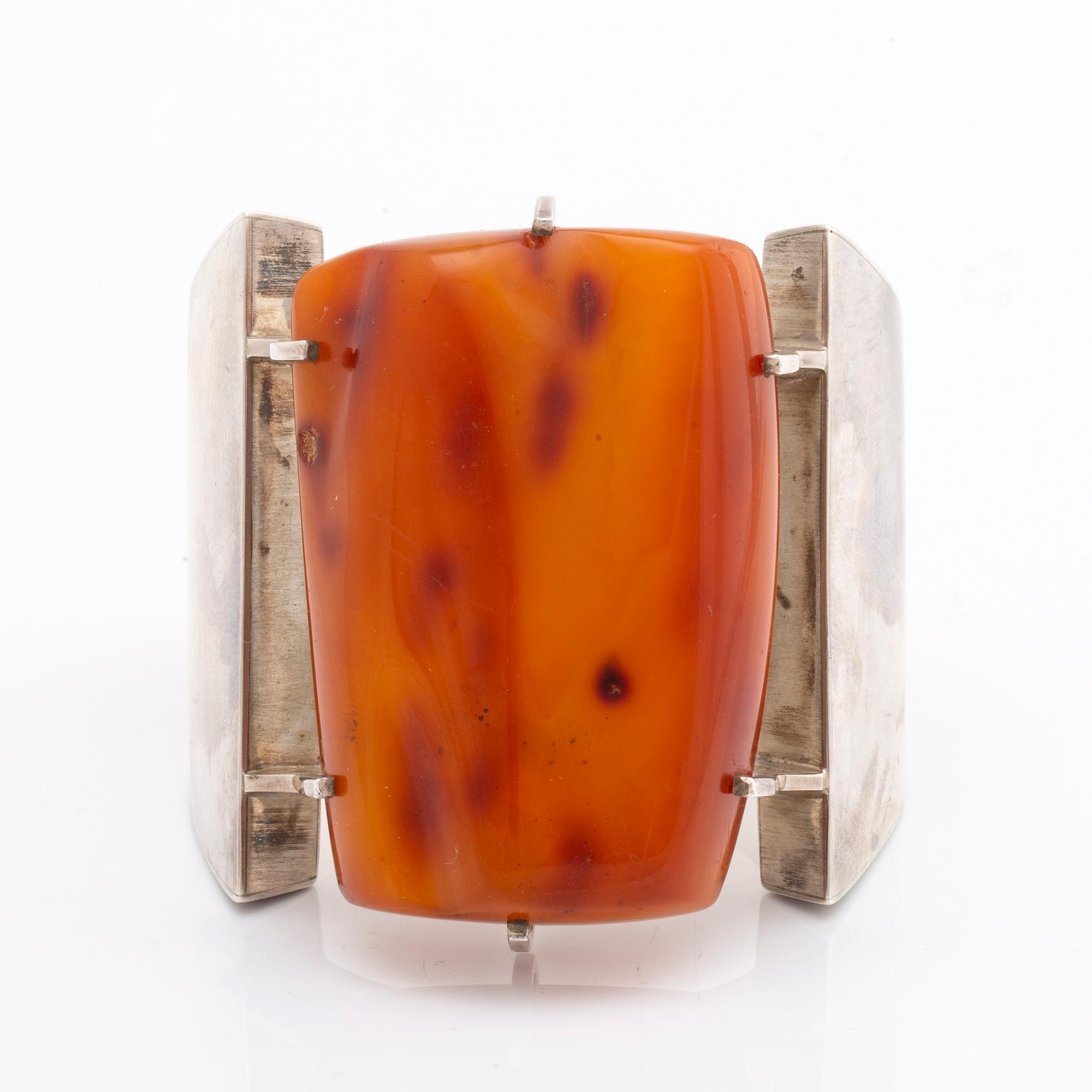 BANGLE, silver w amber, hinge mechanism, widest part approx 7 cm.