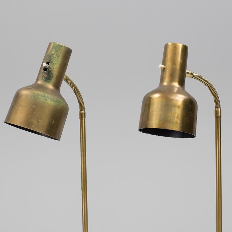 A pair of brass floor lamps, "MAE 27".