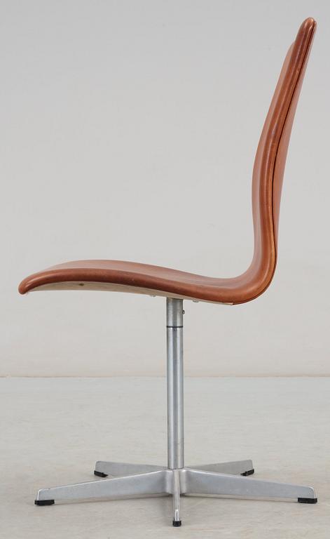An Arne Jacobsen 'Oxford' brown leather and aluminium chair, Fritz Hansen, Denmark.