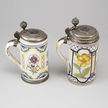 Two pewter mounted faience tankards, Germany, 18th century..