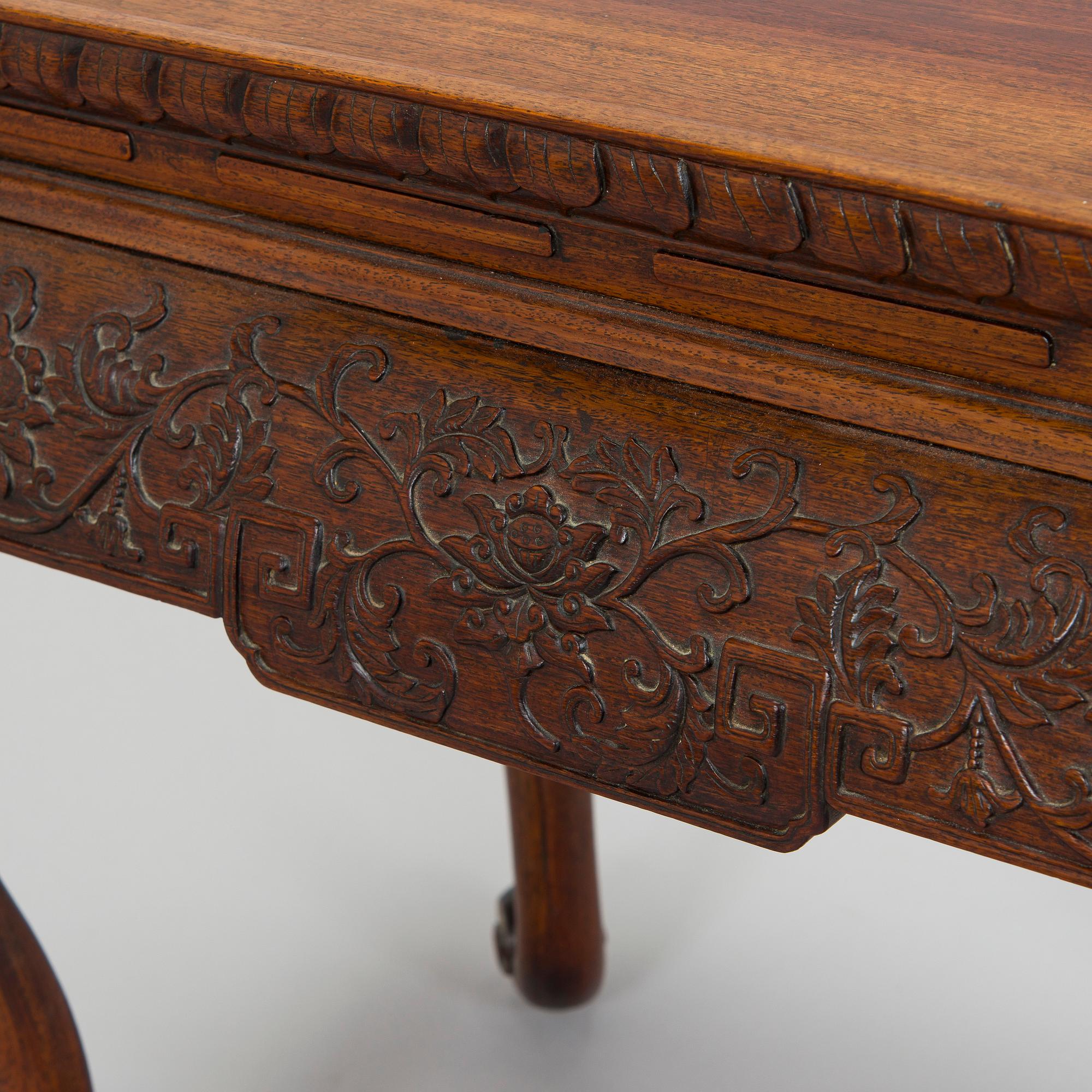 A Chinese waisted huanghuali table, late Qing dynasty/Republic.