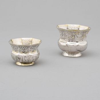 Two Russian 18th century parcel-gilt silver charkas, unidentified makers marks, Moscow.