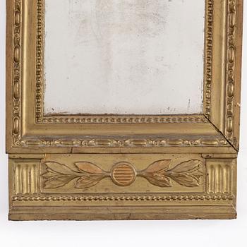 A lage Gustavian mirror.