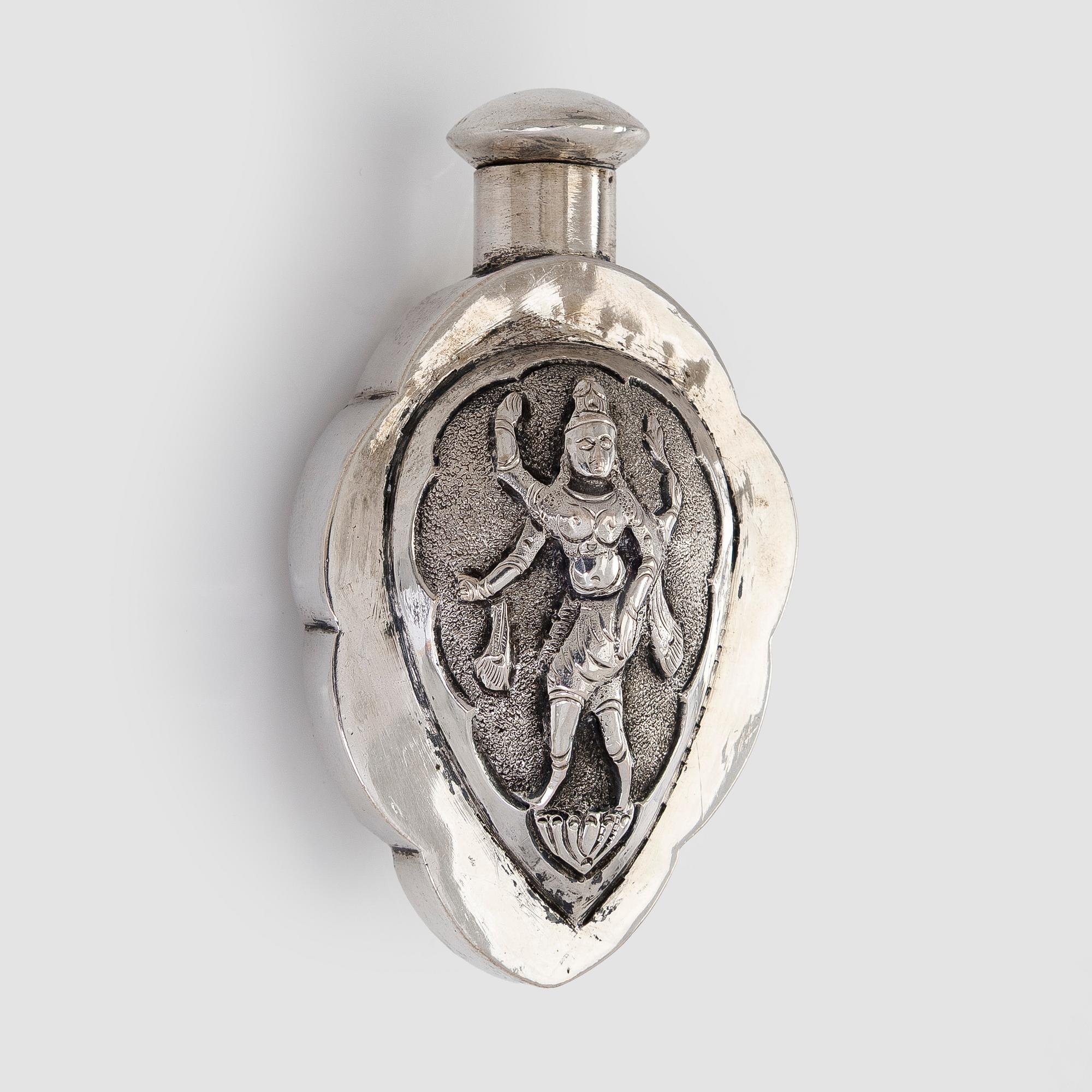 A silver bowl, Tillander import marks, 1983, and a silver snuff bottle.