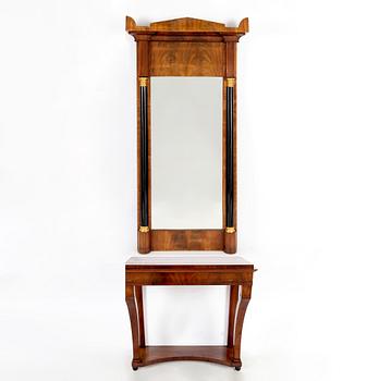 A mahogany veneered mirror with console table, first half of the 19th Century.